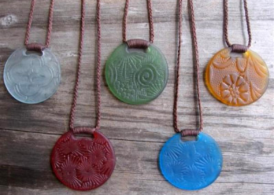 Antique pressed glass round pendants with binding feature $56 CLEAR; PALE GREEN; AMBER; RED; TURQUOISE BLUE Colours available: amber, purple, red, mid green, turquoise blue, clear, pale blue