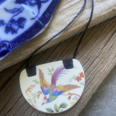 Recycled-ceramic-semi-circle-pendant-magical-bird $68